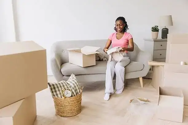 Person carefully going through items during a house clearance